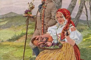 młoda dziewczyna i chłopak z jajkami wielkanocnymi na tacy